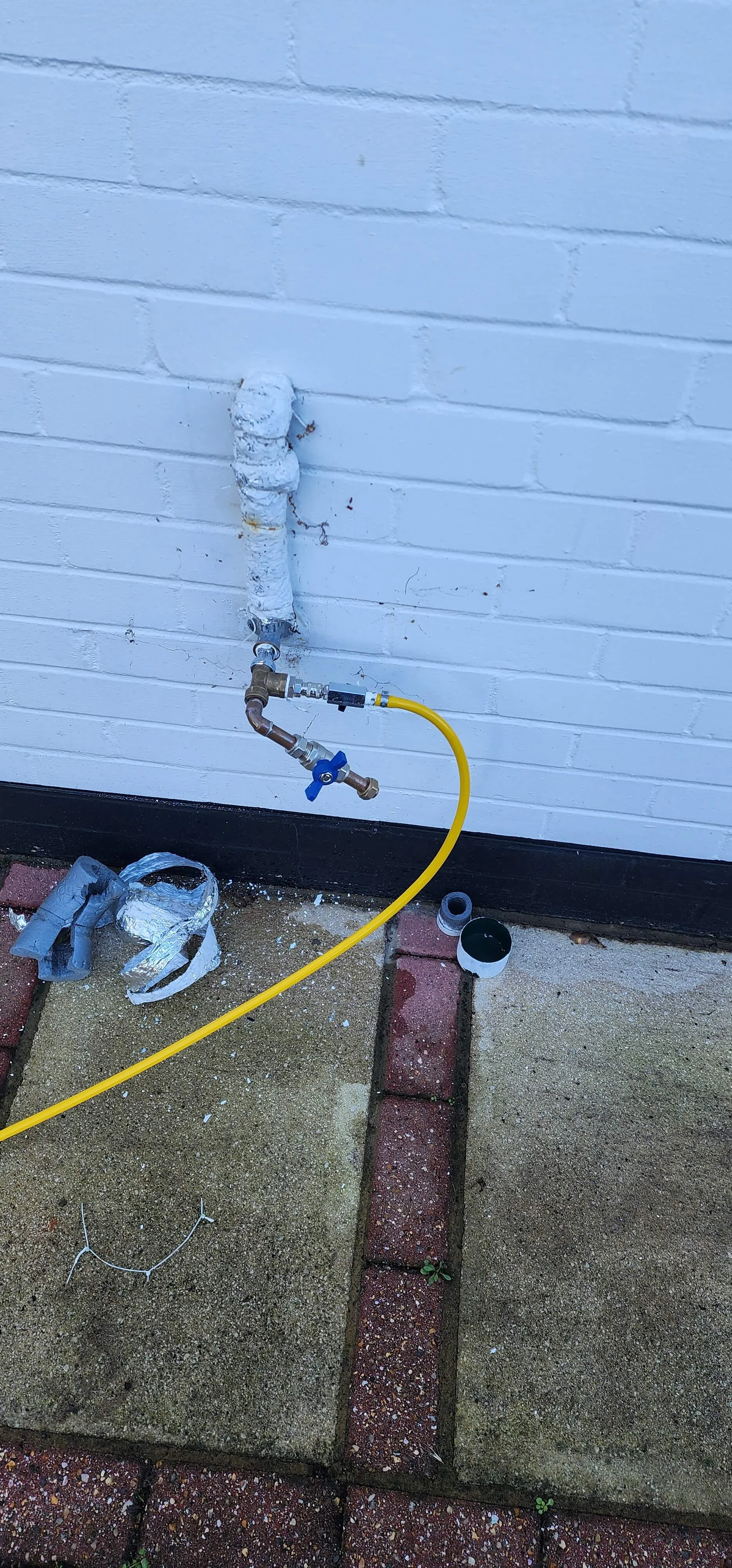 External supply pipe connection prepared for tracer gas testing in Addlestone