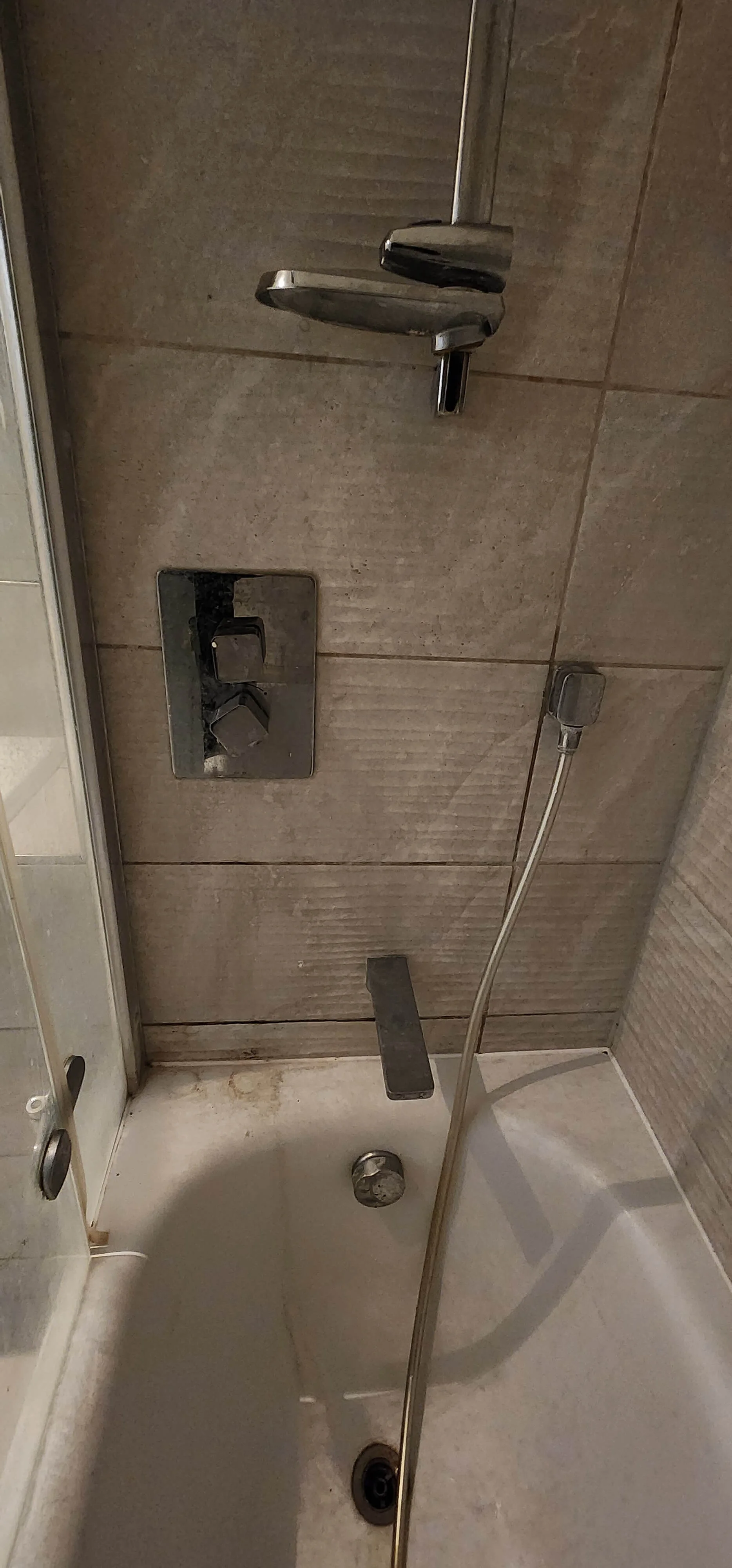 Bath and shower area inspected during bathtub leak investigation in Barnet