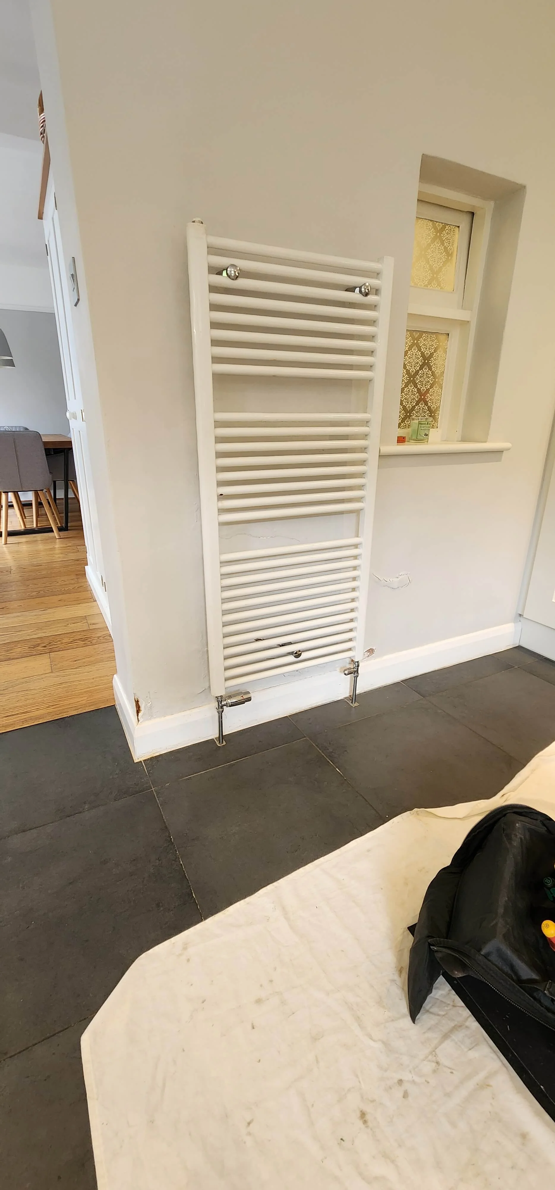 Radiator pipework area before central heating leak detection in Betchworth