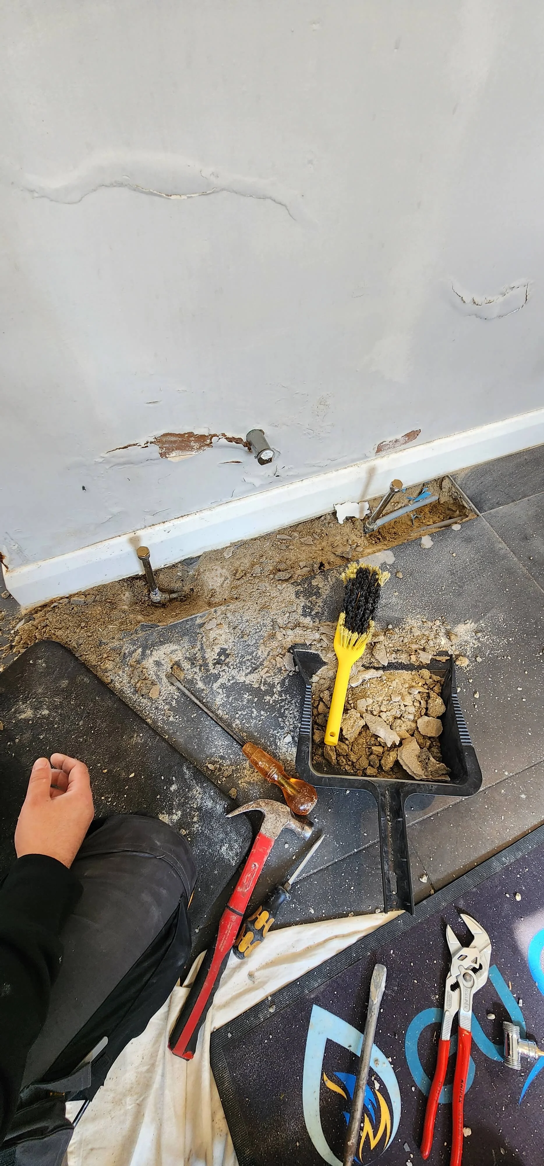Exposed central heating pipework route during Betchworth investigation