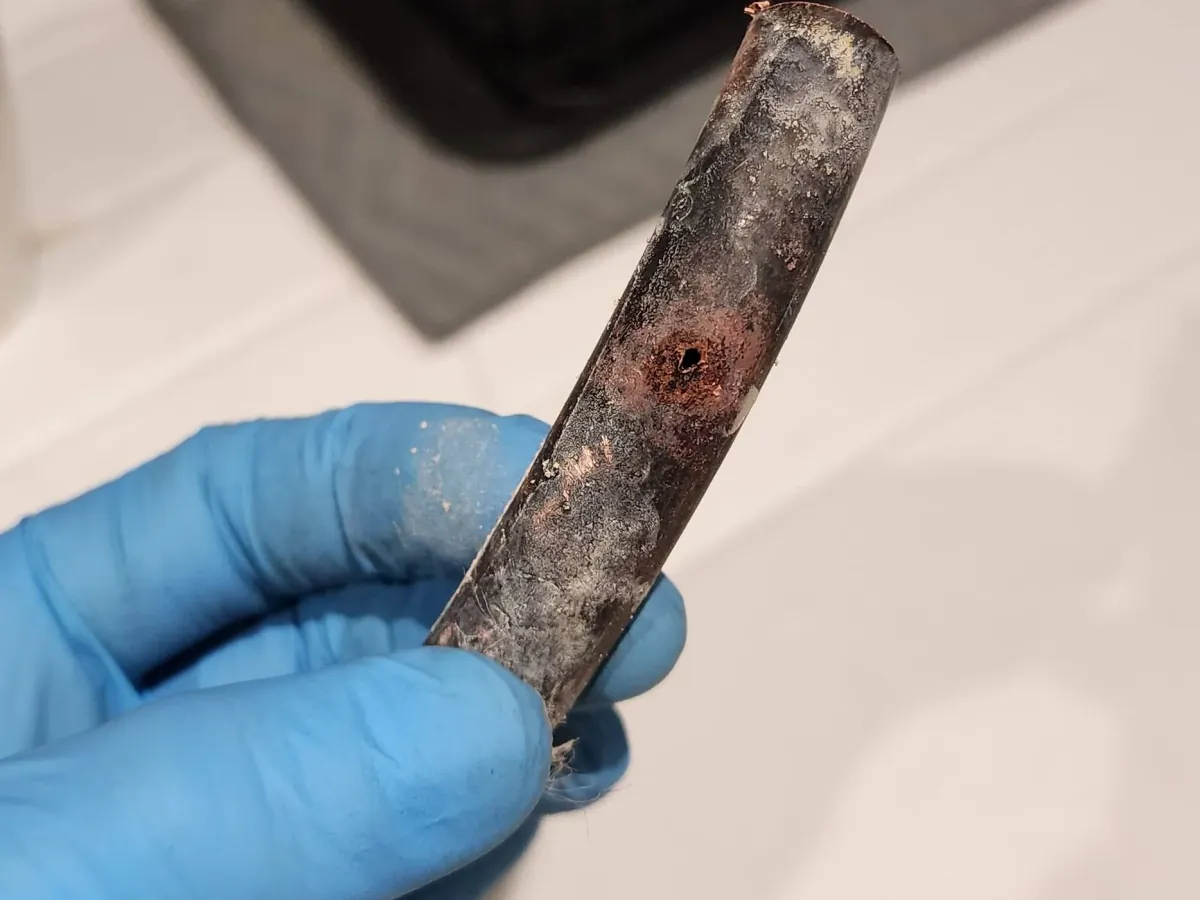 Close up of damaged pipework from Camberley hot water leak