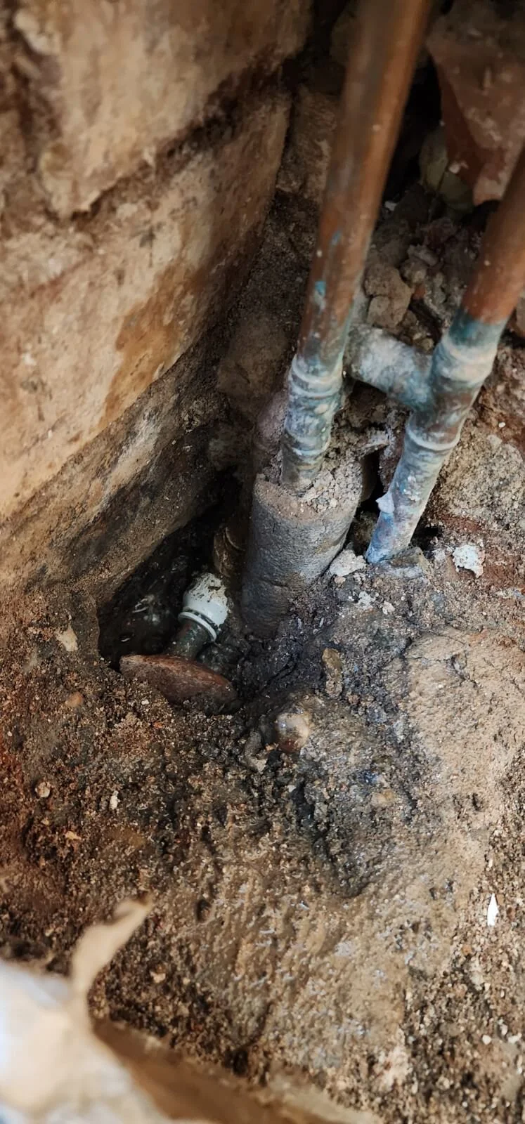 Close-up of exposed pipework from Coventry mains water leak