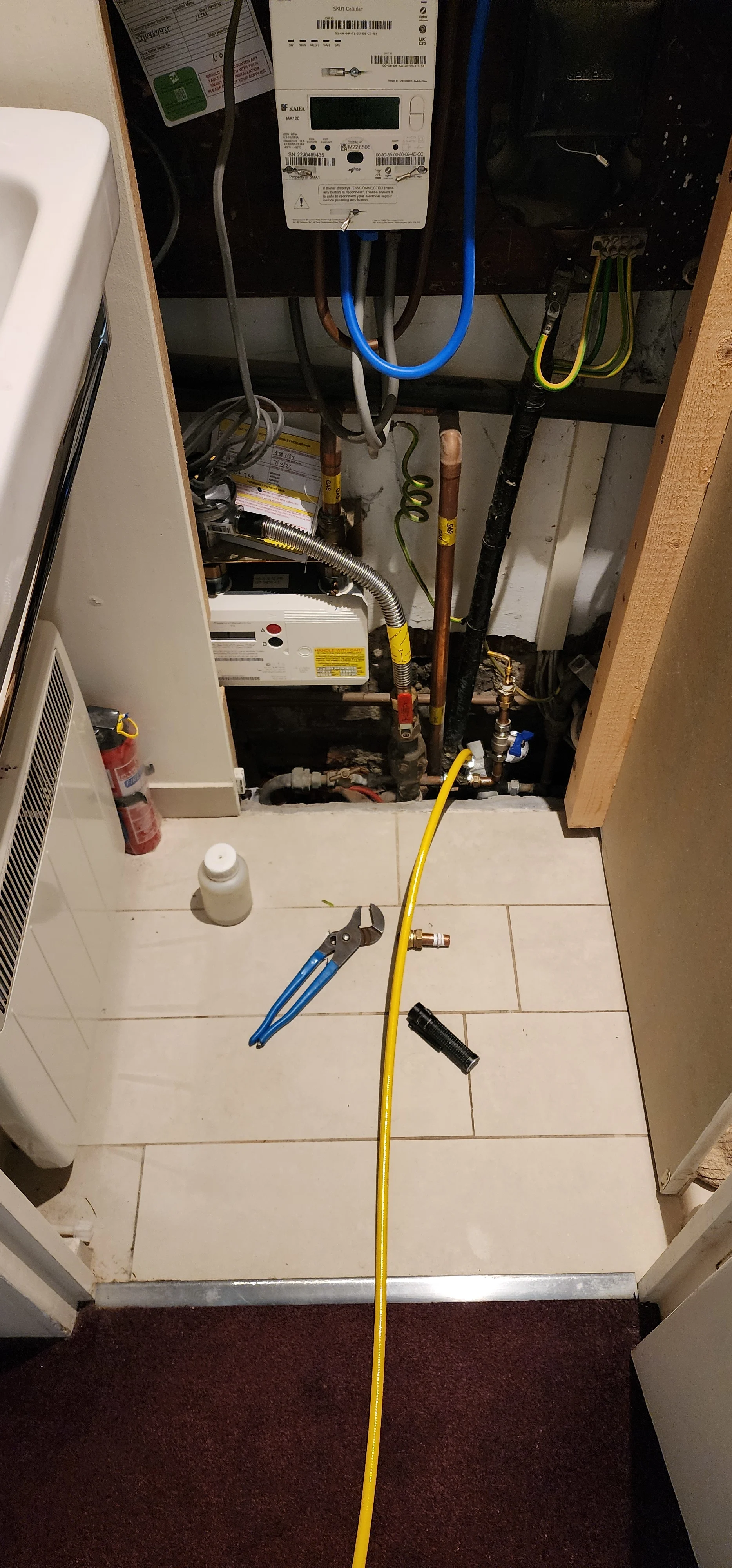 Internal meter and pipework area inspected during mains water leak detection in East Sheen