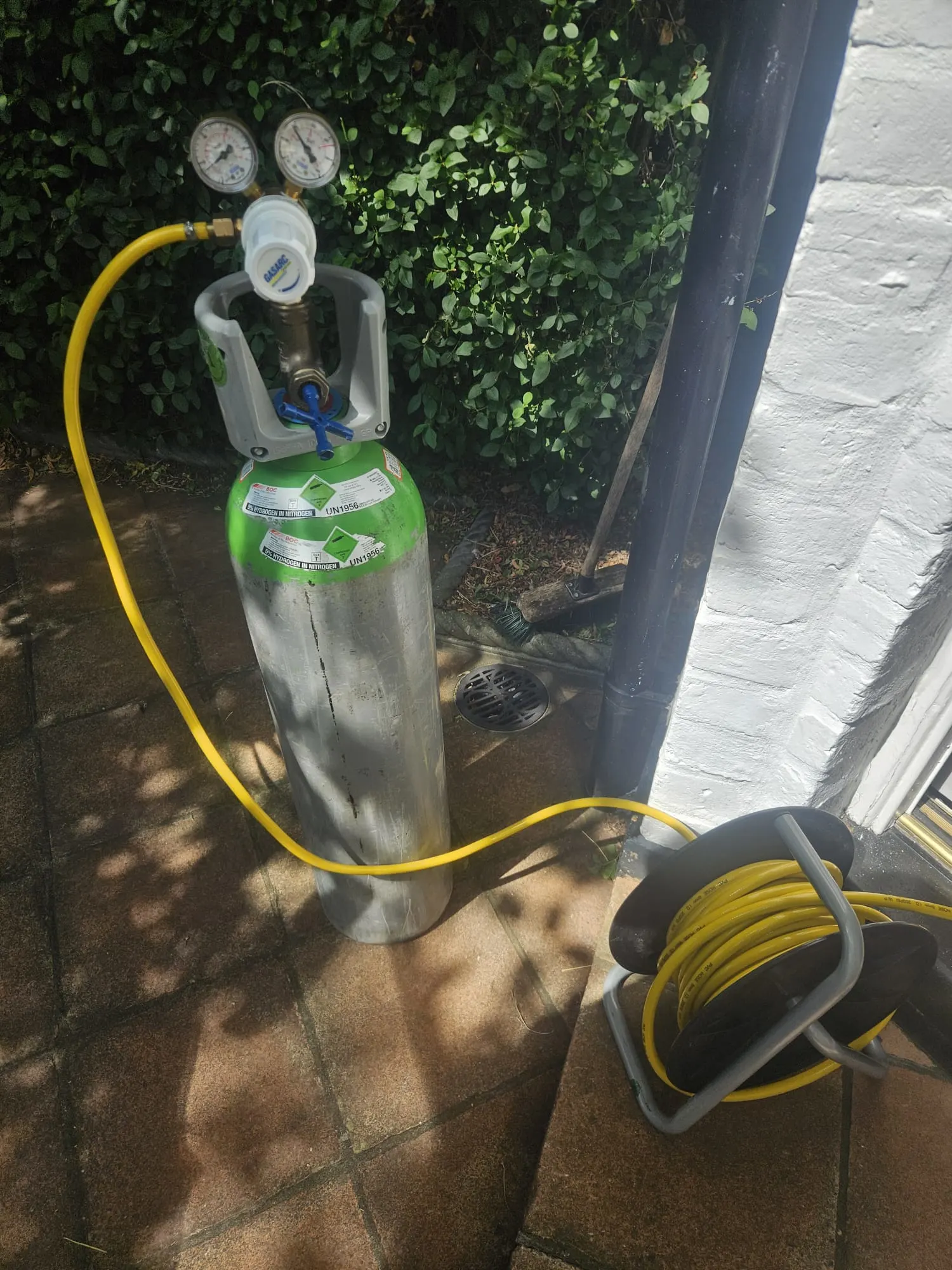 Test equipment set up outside during mains water leak detection in East Sheen