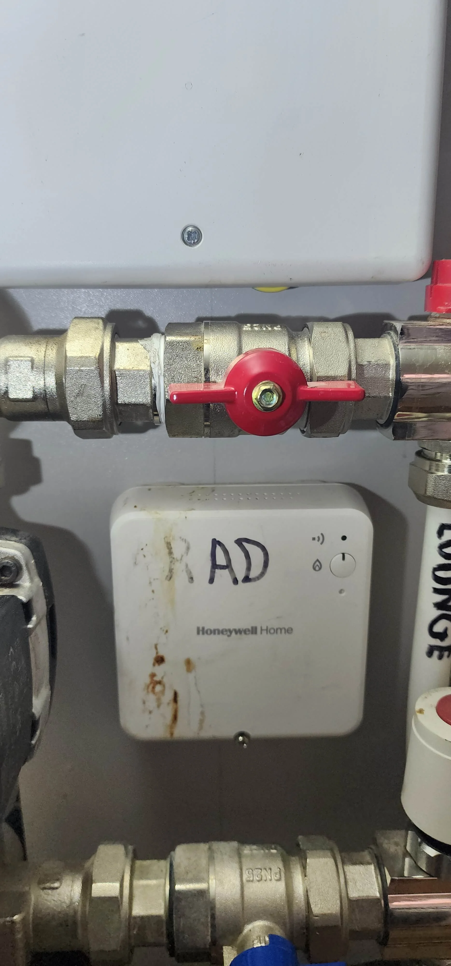 Close-up heating manifold connection checked during Farnham leak detection