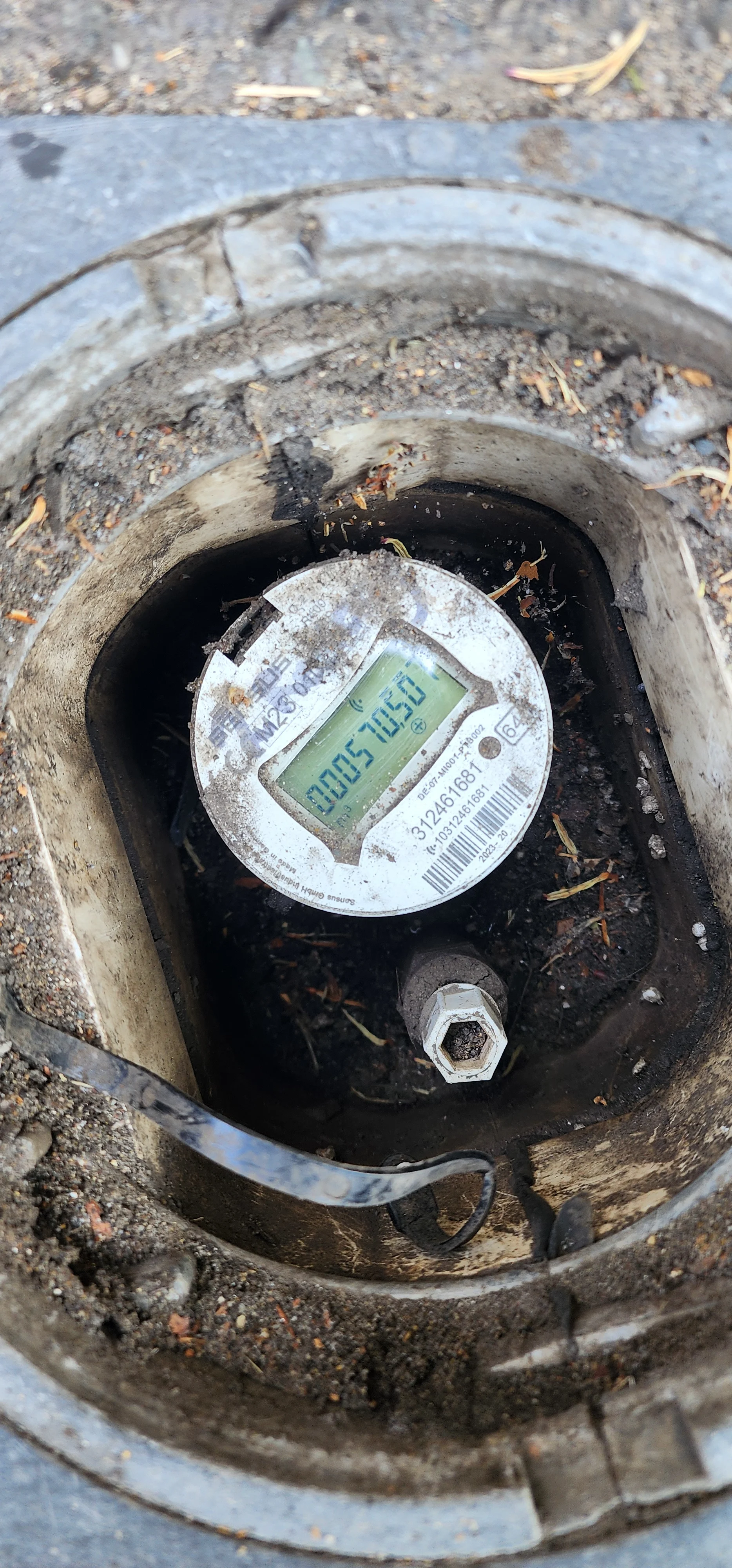 Water meter checked during mains water leak detection in Guildford