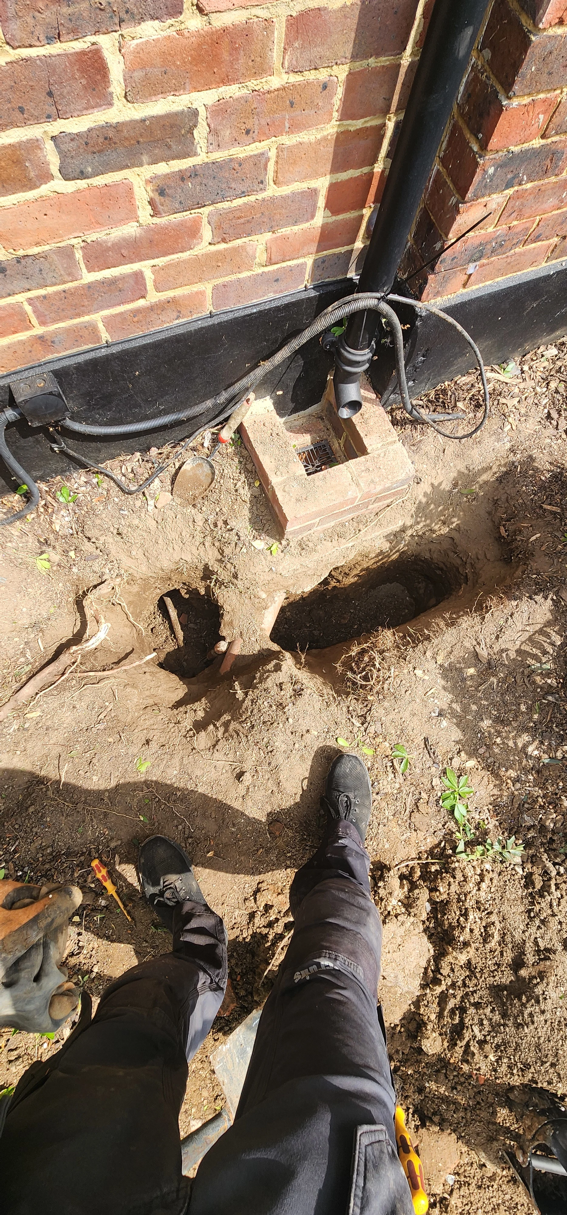 External ground opened around a suspected mains water supply leak in Kingston
