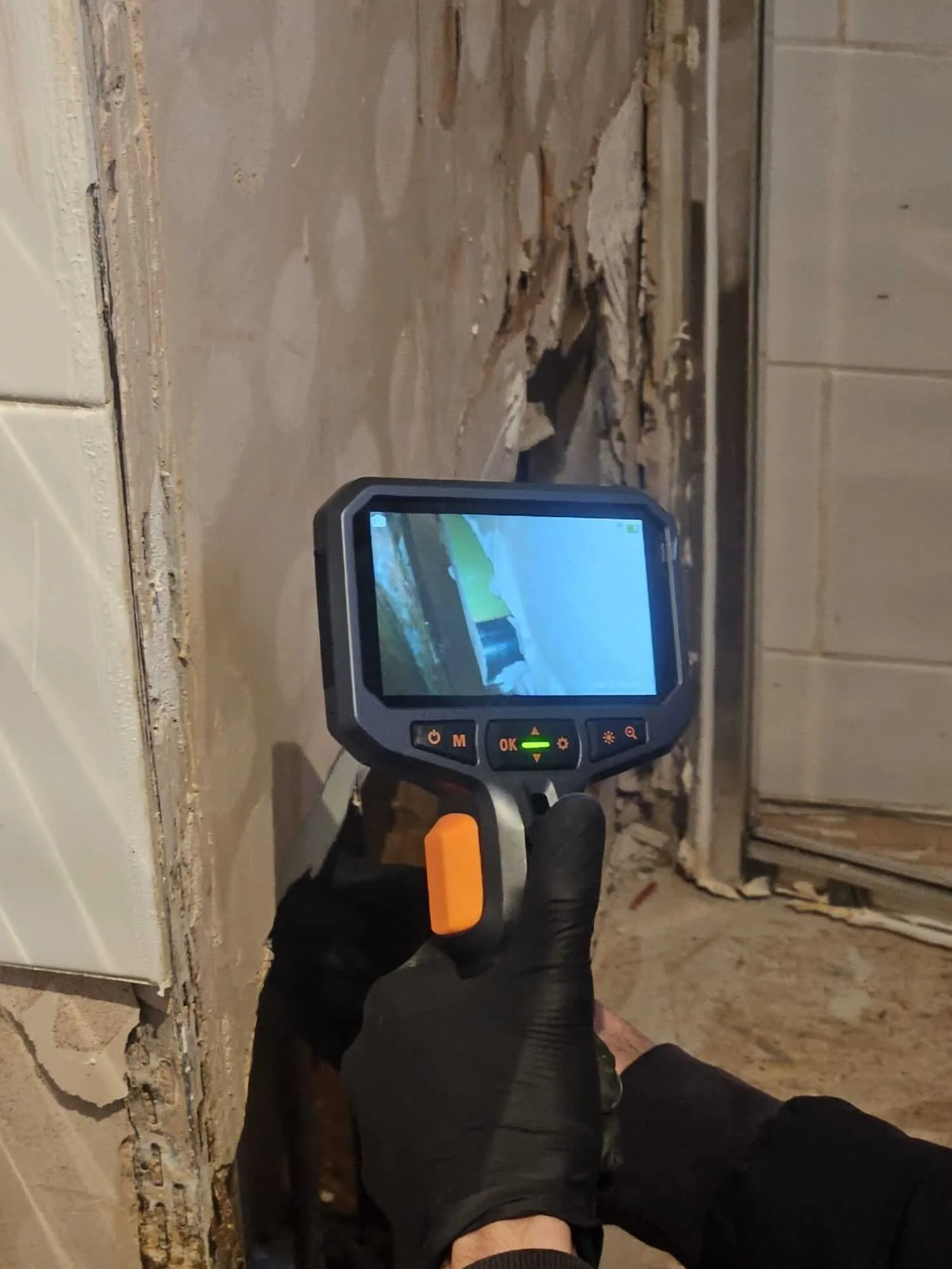 Thermal imaging camera used during Kingston shower leak investigation