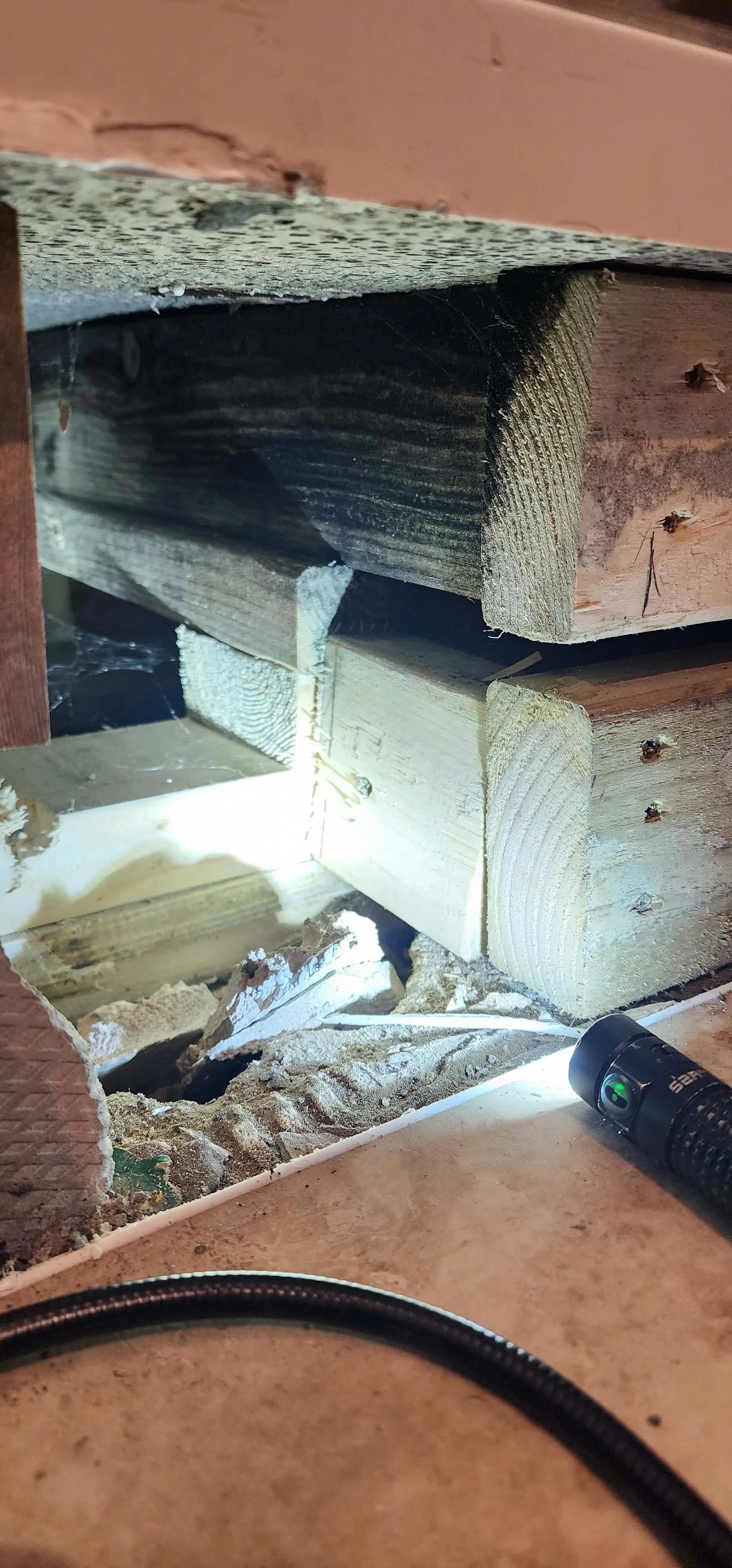 Concealed void opened beneath shower during Portsmouth waste pipe investigation