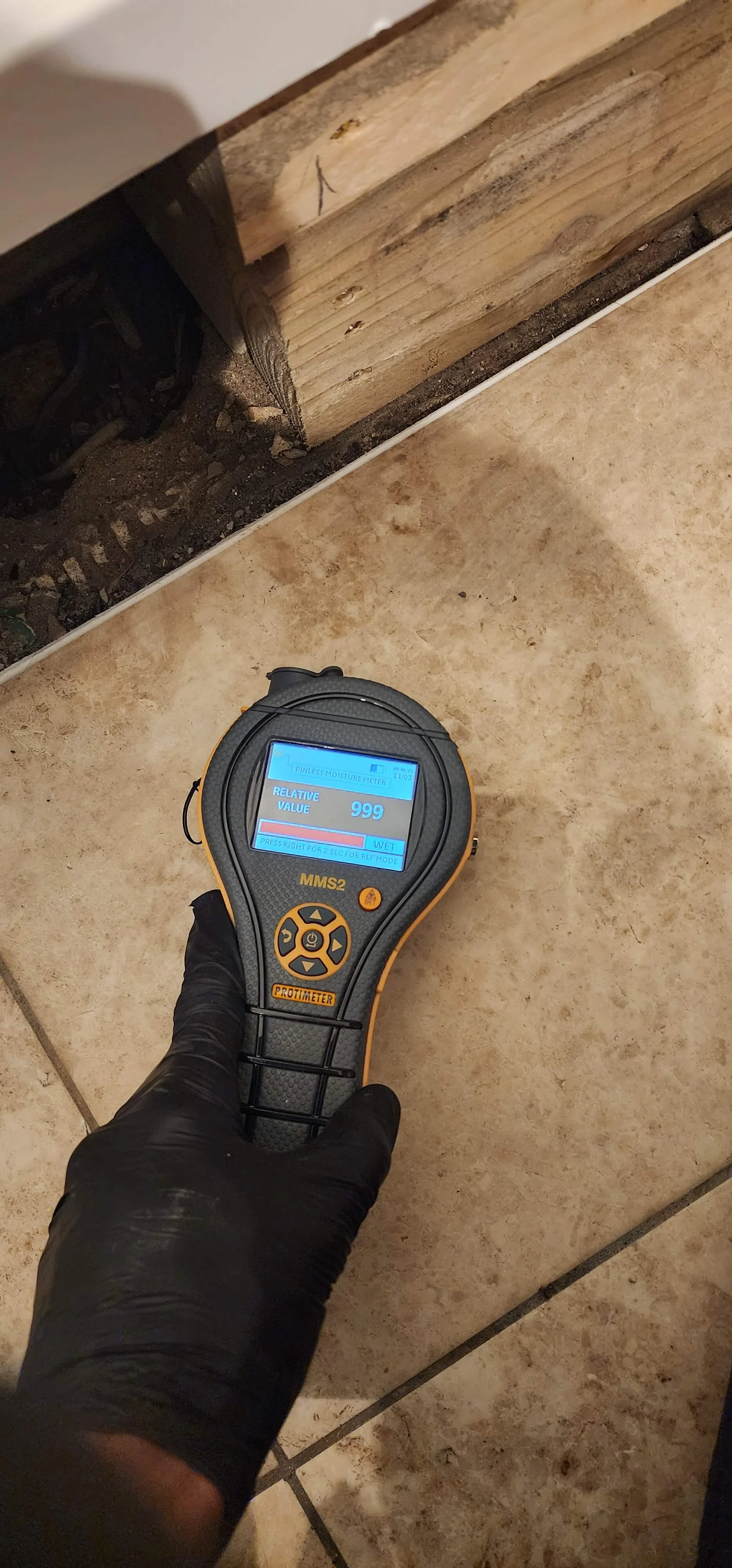 Moisture meter reading during Portsmouth bathroom leak investigation