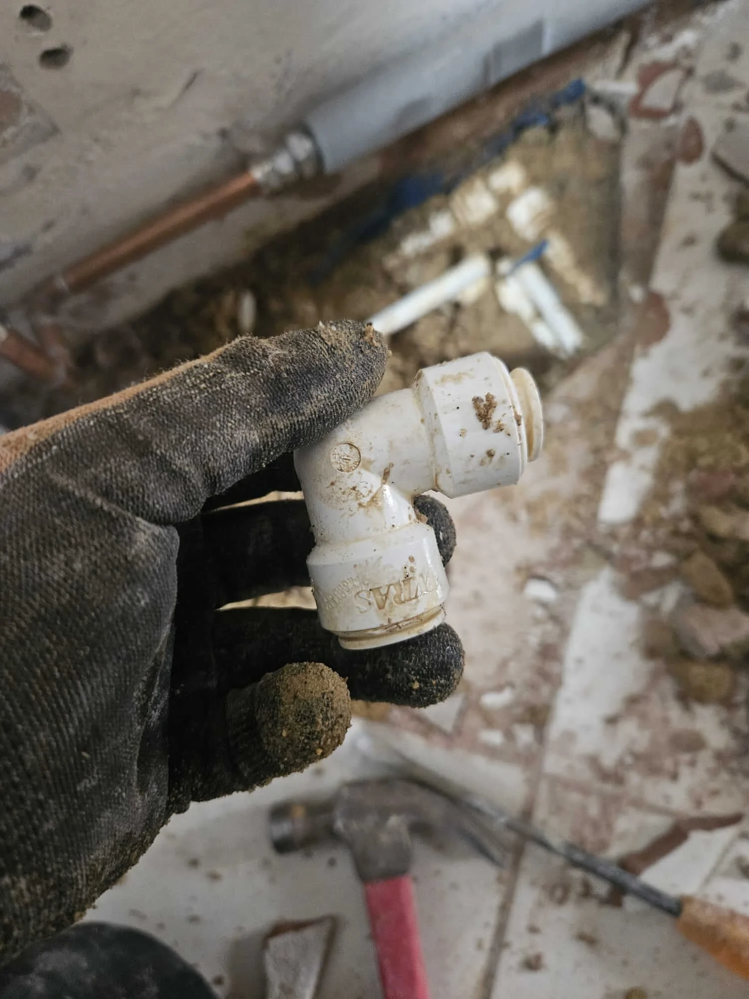 Close-up pipework evidence from mains water leak detection in Sutton