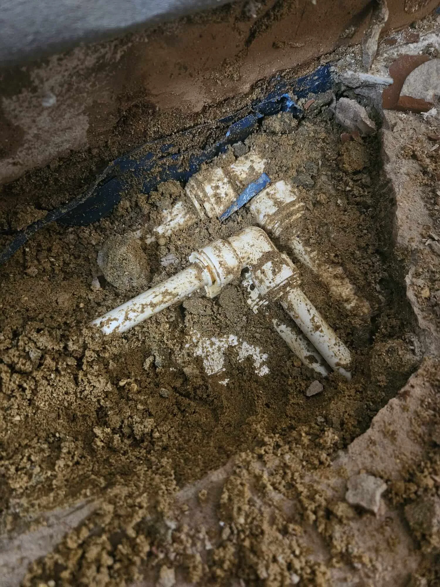 Pipework exposed beneath floor during Sutton leak detection