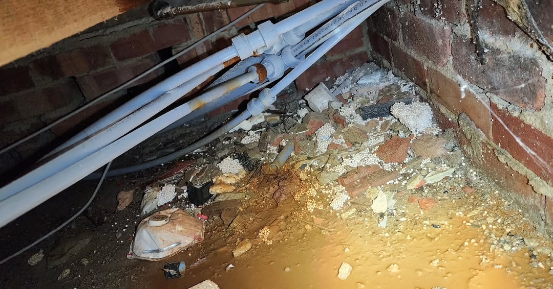 Central heating leak detection evidence under suspended flooring in Windsor