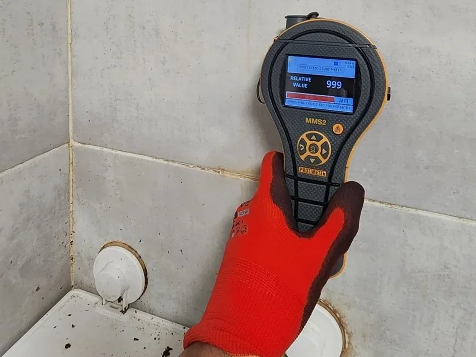 Moisture meter used to document affected areas for leak evidence