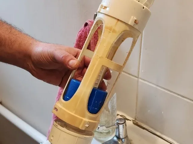 Dye applied around bathroom fittings during water ingress investigation
